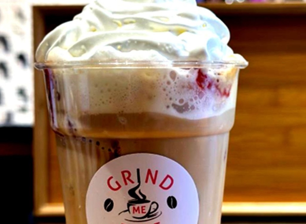 Iced coffee in Grind Me Fine branded glass
