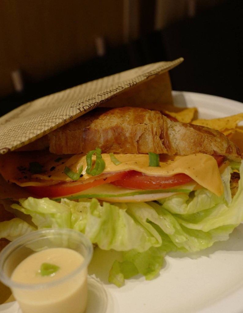 Classic club sandwich with lettuce, tomato, and cheddar