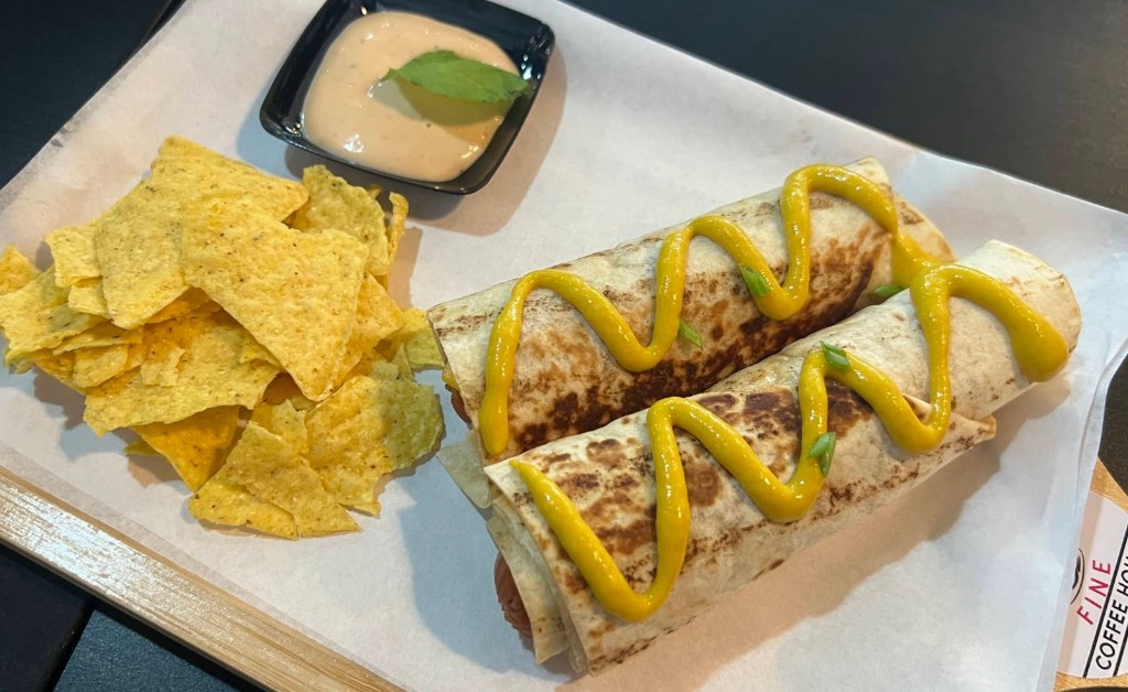 Grilled beef burritos with corn chips and dipping sauce